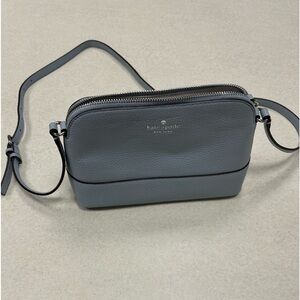 Blue Kate spade crossbody pebbled leather bag in new condition.
